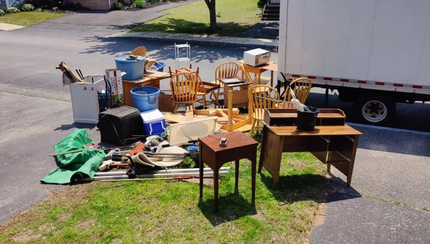 Large pile of unwanted furniture awaiting bulky item removal and disposal by Rapid Junk Removal RI.