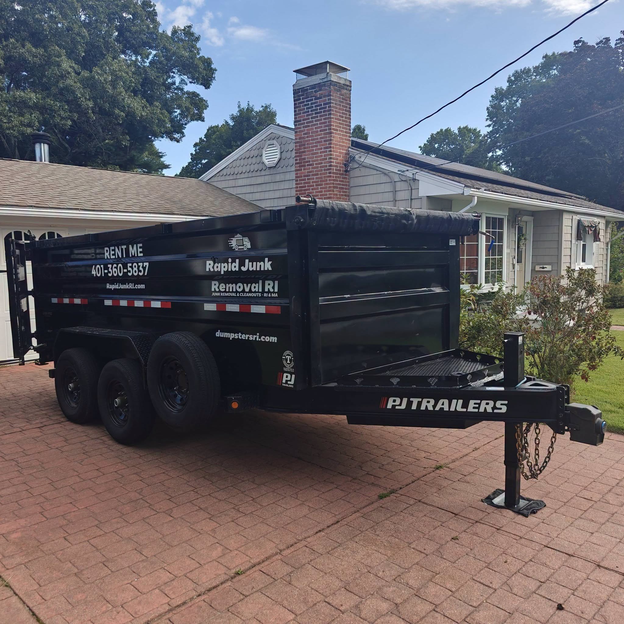 Driveway-friendly 15-yard dumpster rental delivered to a customer's home in Pawtucket, Rhode Island by Rapid Junk Removal RI.